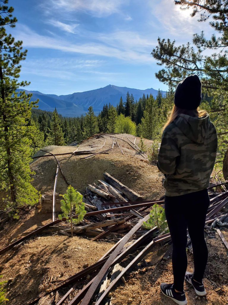 Kristina Grattarola sightseeing at the mountain wearing a Camouflage Hoodie and a snowcap